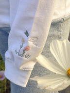 Duck in the flower garden embroidered adult hoodie