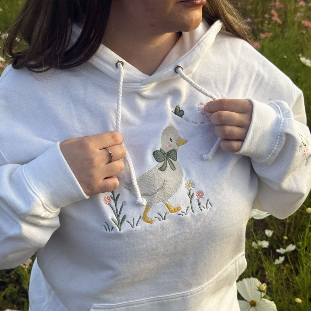 Duck in the flower garden embroidered adult hoodie
