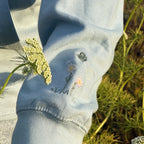 Duck in the flower garden embroidered adult hoodie