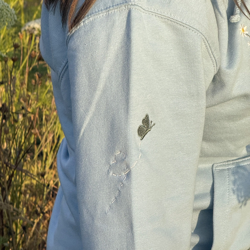 Duck in the flower garden embroidered adult hoodie