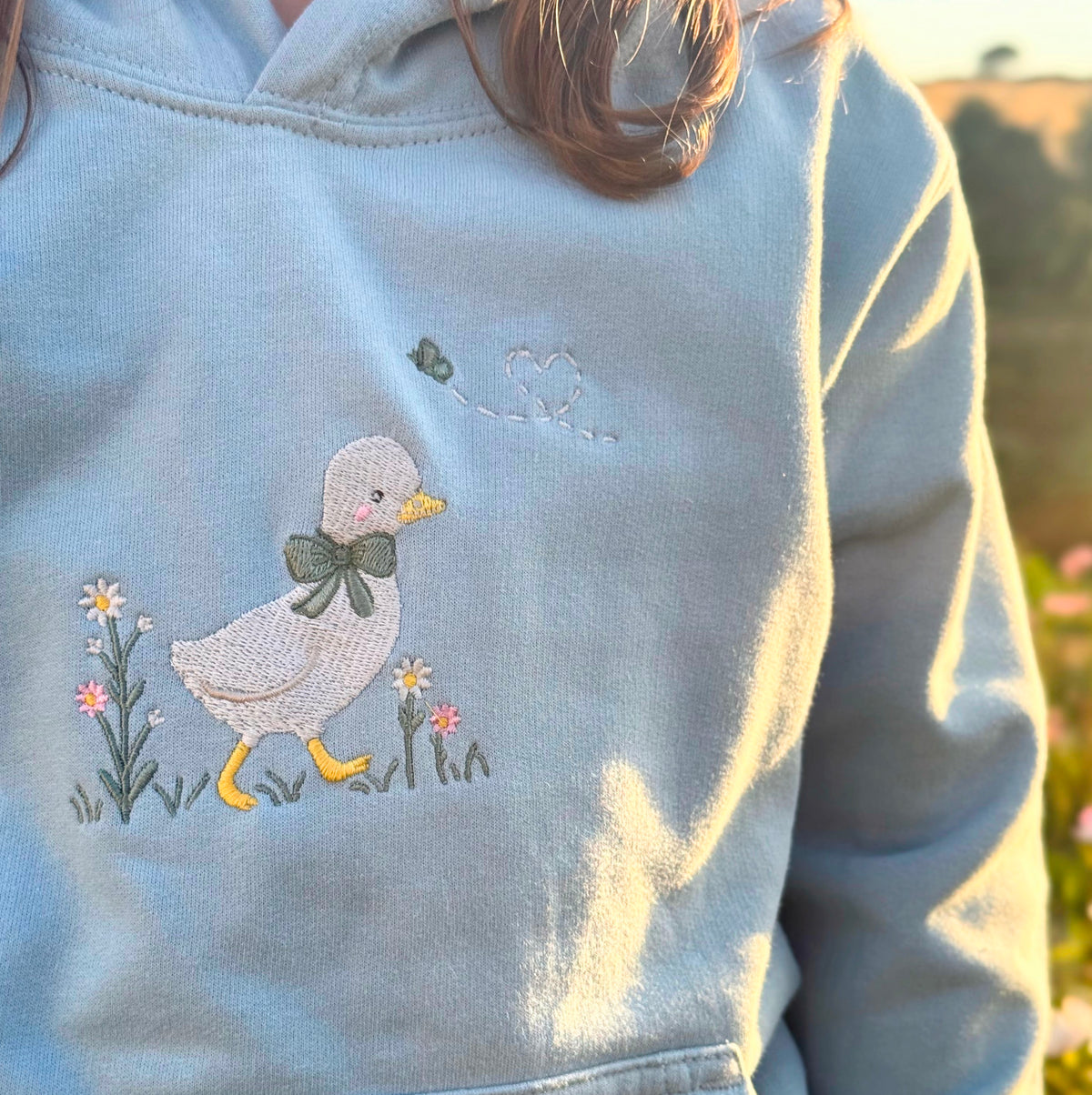 Duck in the flower garden, Signature Embroidered hoodie, ages 7-13