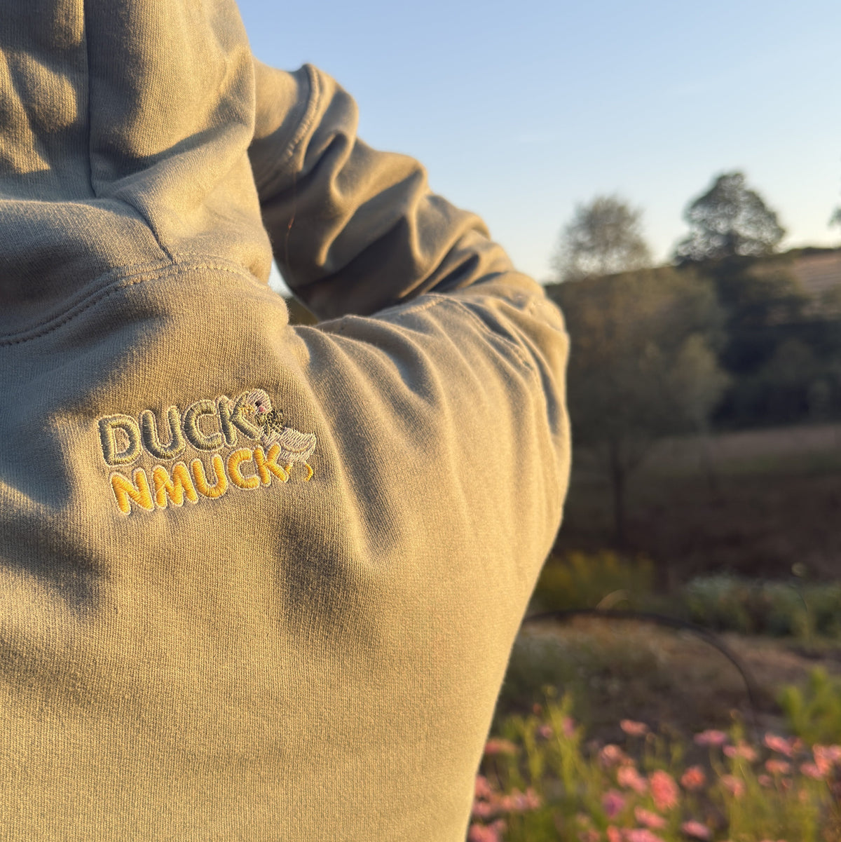 Duck in the flower garden embroidered adult hoodie