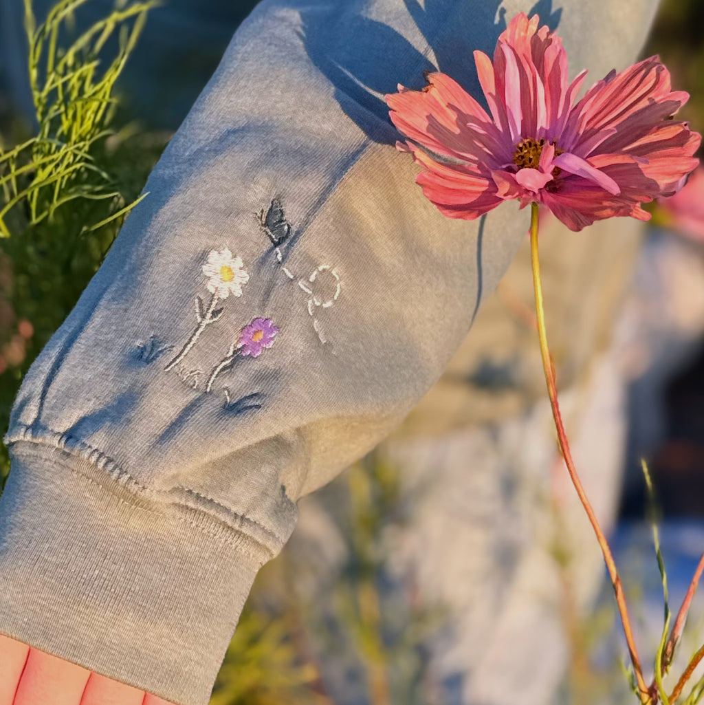 Duck in the flower garden embroidered adult hoodie